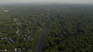 4.8K aerial stock footage flying by Fairfax County Parkway, suburban neighborhoods, Burke, Virginia, sunset Aerial Stock Footage | AX76_016