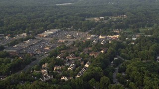 4.8K aerial stock footage flying by town houses near strip malls, Springfield, Virginia, sunset Aerial Stock Footage | AX76_019E