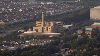 AX76_023 - 4.8K aerial stock footage of Covanta Energy Corporation power plant, Alexandria, Virginia, sunset