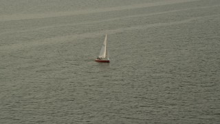 4.8K aerial stock footage tracking a sailboat on the Potomac River, Washington, D.C., sunset Aerial Stock Footage | AX76_036