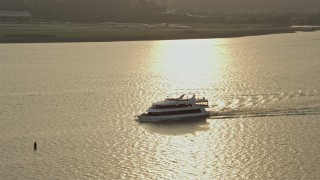 4.8K aerial stock footage tracking a ferry on the Potomac River Arlington, Virginia, sunset Aerial Stock Footage | AX76_039