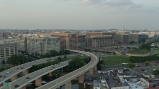 4.8K aerial stock footage of Federal Communications Commission and government office buildings in Washington D.C., sunset Aerial Stock Footage | AX76_046