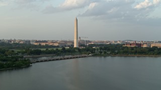 4.8K aerial stock footage of Washington Monument seen from Tidal Basin, Washington D.C., sunset Aerial Stock Footage | AX76_060