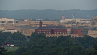 4.8K aerial stock footage Sidney Yates Building and part of the Holocaust Memorial Museum, Washington D.C., sunset Aerial Stock Footage | AX76_070