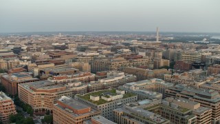 4.8K aerial stock footage of the Washington Monument over office and apartment buildings, Washington D.C., sunset Aerial Stock Footage | AX76_075