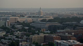 4.8K aerial stock footage of the United States Capitol dome behind Senate Office Buildings, Washington D.C., sunset Aerial Stock Footage | AX76_087