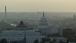 4.8K aerial stock footage Library of Congress, United States Capitol, Washington Monument, Supreme Court, Washington D.C., sunset Aerial Stock Footage | AX76_096