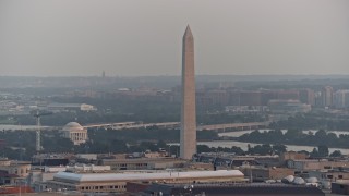 AX76_103E - 4.8K aerial stock footage of the Jefferson Memorial and the Washington Monument,  Washington D.C., sunset