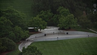 AX76_114 - 4.8K aerial stock footage of President John F. Kennedy Gravesite at Arlington National Cemetery, Arlington, Virginia, twilight