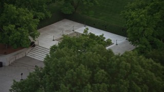 AX76_115 - 4.8K aerial stock footage of President John F. Kennedy Gravesite at the Arlington National Cemetery, Arlington, Virginia, twilight