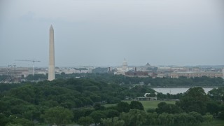 4.8K aerial stock footage of Washington Monument, Yates Building, the United States Capitol in Washington, D.C., twilight Aerial Stock Footage | AX76_130