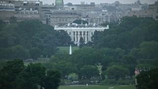 4.8K aerial stock footage of the White House, eclipsed by Washington Monument, Washington, D.C., twilight Aerial Stock Footage | AX76_131E