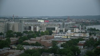 AX76_137 - 4.8K aerial stock footage approaching Nationals Park stadium in Washington, D.C., twilight