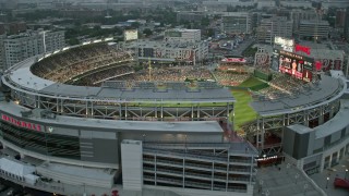 4.8K aerial stock footage flying by Nationals Park crowded with fans, Washington, D.C., twilight Aerial Stock Footage | AX76_139