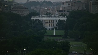 4.8K aerial stock footage of the White House, eclipsed by Washington Monument, Washington, D.C., twilight Aerial Stock Footage | AX76_150