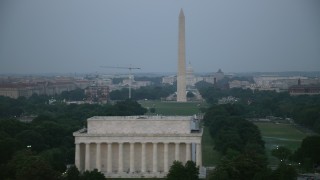 AX76_153E - 4.8K aerial stock footage of the Washington Monument, National Mall, United States Capitol, Lincoln Memorial, Washington, D.C., twilight