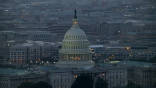 4.8K aerial stock footage of the United States Capitol dome, office buildings in background, Washington, D.C., twilight Aerial Stock Footage | AX76_168E