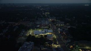 AX76_188E - 4.8K aerial stock footage following Columbia Pike through Arlington, Virginia, night