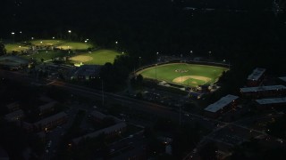 AX76_190 - 4.8K aerial stock footage of baseball fields in Barcroft Park, Arlington, Virginia, night