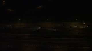 4.8K aerial stock footage of a bird's eye view of light traffic on Interstate 95, Alexandria, Virginia, night Aerial Stock Footage | AX77_003E