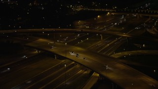 4.8K aerial stock footage panning across Interstate 95 to reveal Woodrow Wilson Memorial Bridge, Fort Washington, Maryland, night Aerial Stock Footage | AX77_010