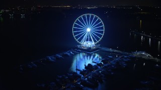 4.8K aerial stock footage of the Capitol Wheel and the National Harbor Marina, Maryland, night Aerial Stock Footage | AX77_018