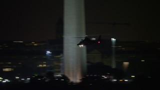 4.8K aerial stock footage tracking a helicopter flying over National Mall, Washington, D.C., night Aerial Stock Footage | AX77_055