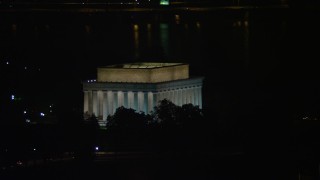 4.8K aerial stock footage of the Lincoln Memorial with Tidal Basin in the background, Washington, D.C., night Aerial Stock Footage | AX77_068