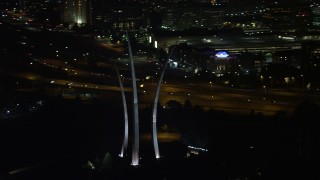 4.8K aerial stock footage flying by United States Air Force Memorial, Arlington National Cemetery, Arlington, Virginia, night Aerial Stock Footage | AX77_073