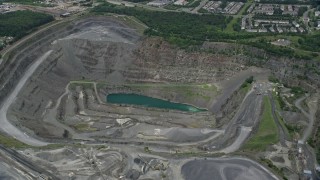 AX78_005E - 4.8K aerial stock footage approaching Vulcan Lake at the bottom of a quarry in Manassas, Virginia