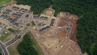 4.8K aerial stock footage of a bird's eye view of apartment buildings and construction in Manassas, Virginia Aerial Stock Footage | AX78_014