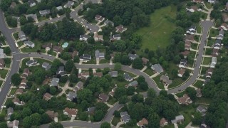 4.8K aerial stock footage tilting to suburban homes, roads, trees in Herndon, Virginia Aerial Stock Footage | AX78_028