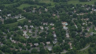 4.8K aerial stock footage tilting to a bird's eye view of a suburban neighborhood in Gaithersburg, Maryland Aerial Stock Footage | AX78_045