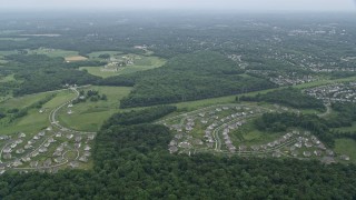 AX78_047E - 4.8K aerial stock footage tilting from bird's eye view of neighborhoods in Rockville, Maryland