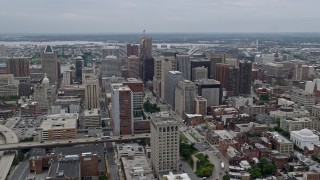 AX78_094E - 4.8K aerial stock footage flying by I-83 and Downtown Baltimore skyscrapers, Maryland