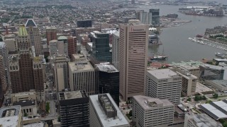 4.8K aerial stock footage of Downtown Baltimore skyscrapers, Inner Harbor in the background, Maryland Aerial Stock Footage | AX78_097E