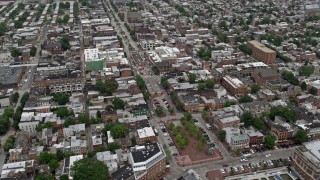 4.8K aerial stock footage of shops and apartment buildings beside Broadway in Baltimore, Maryland Aerial Stock Footage | AX78_102E