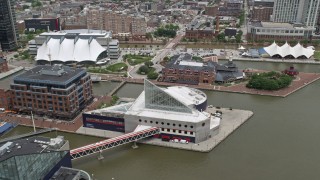 4.8K aerial stock footage flying over National Aquarium, to Pier 5 Hotel Complex and lighthouse, Downtown Baltimore, Maryland Aerial Stock Footage | AX78_111