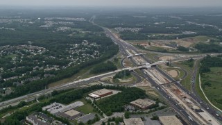 4.8K aerial stock footage flying over office buildings by I-95 to approach suburban neighborhoods in Baltimore, Maryland Aerial Stock Footage | AX78_131E