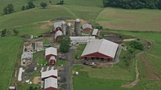 4.8K aerial stock footage of silos and red barns in Abigdon, Maryland Aerial Stock Footage | AX78_146