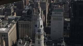 AX79_016 - 4.8K aerial stock footage orbiting William Penn statue on Philadelphia City Hall, Pennsylvania