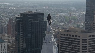 4.8K aerial stock footage of the William Penn statue on Philadelphia City Hall, Downtown Philadelphia, Pennsylvania Aerial Stock Footage | AX79_039