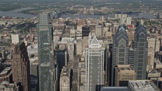 AX79_053E - 4.8K aerial stock footage flying over skyscrapers toward city hall and convention center in Downtown Philadelphia, Pennsylvania