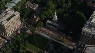 AX79_056E - 4.8K aerial stock footage approaching and orbiting Independence Hall and park in Downtown Philadelphia, Pennsylvania