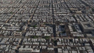 AX79_075E - 4.8K aerial stock footage following S 12th Street through urban neighborhoods in South Philadelphia, reveal sports fields, Pennsylvania