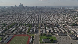 4.8K aerial stock footage flying over South Philadelphia neighborhoods with a view of the downtown skyline, Pennsylvania Aerial Stock Footage | AX79_084