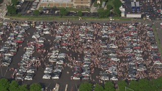 4.8K aerial stock footage of crowds in a parking lot near Campbell's Field, Camden, New Jersey Aerial Stock Footage | AX79_094