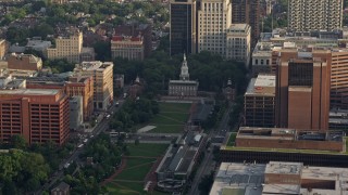 AX80_006 - 4.8K aerial stock footage of Independence Hall seen across Independence Mall in Downtown Philadelphia, Pennsylvania, Sunset