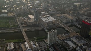 AX80_010 - 4.8K aerial stock footage of small bridges over Schuylkill River, Main Post Office, 30th Street Station, Philadelphia, Pennsylvania, Sunset