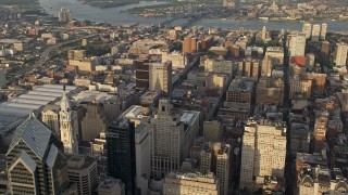 4.8K aerial stock footage flying by office and apartment buildings, reveal City Hall, Downtown Philadelphia, Pennsylvania, Sunset Aerial Stock Footage | AX80_023E